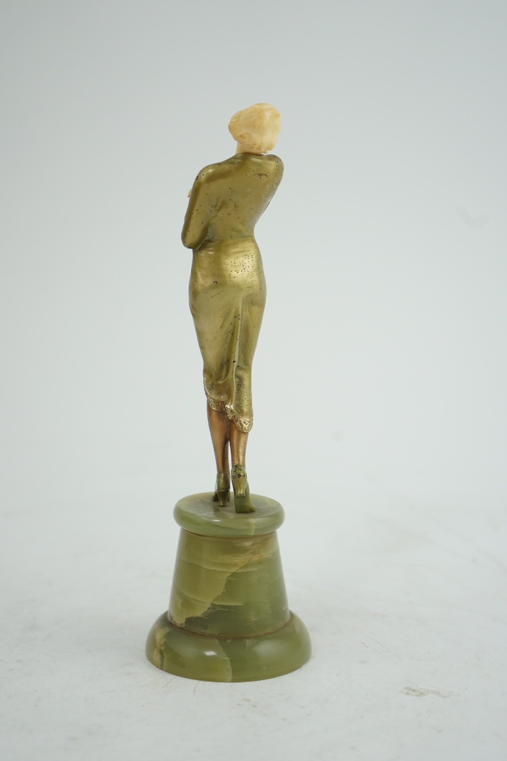 Attributed to Josef Lorenzl. An Art Deco bronze and ivory figure of a stylish lady